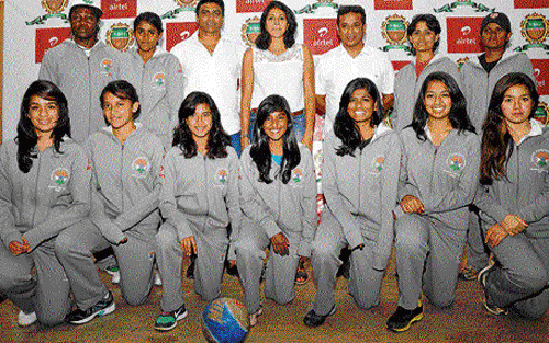 Determined: Elvis Joseph, Reeth Abraham and Jude Felix (in white) along with the soccer team.