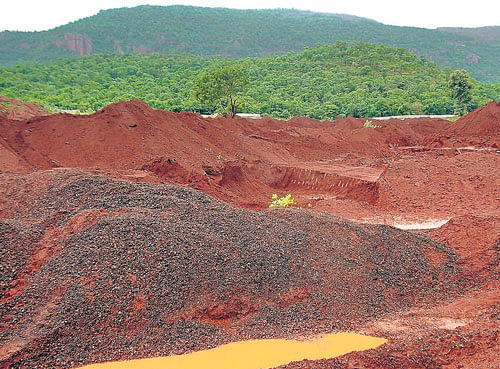 hard evidence: Illegally stocked iron ore seized from a stockyard at Siddapur in Sandur taluk in Bellary district. dh photo