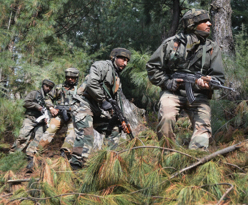 Army jawans patrol near Line of Control (LOC) in Poonch in Monday. PTI Photo