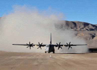 An Indian Air Force Lockheed Martin C-130J Super Hercules kicks up a cloud of dust after landing at the high-altitude Daulat Beg Oldie military airstrip in the Ladakh region of the Indian Himalayas on August 20, 2013.  Ministry of Defence handout picture