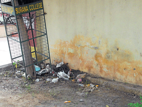 menace: Garbage disposed of inside a tree guard on MG Road.