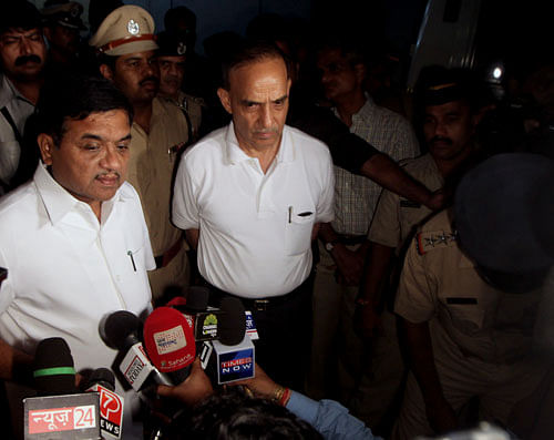 Maharashtra Home Minister R.R. Patil, left, and Mumbai Commissioner of police Satyapal Singh talk to the media at Jaslok Hospital where a 22-year-old woman photojournalist is admitted after she was allegedly gang raped in Mumbai on Friday, Aug. 23, 2013. The young woman photojournalist was gang raped while her male colleague was tied up and beaten in India's business hub of Mumbai, police said Friday. The case was reminiscent of the December gang rape and death of a young university student in the Indian capital that shocked the country. AP Photo
