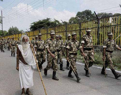 Security personnel patrol a street in Ayodhya on Friday. PTI Photo