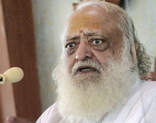 Asaram Bapu addresses a press conference regarding the sexual assault case against him, in his Ashram at Motera, Ahmedabad on Friday. PTI Photo