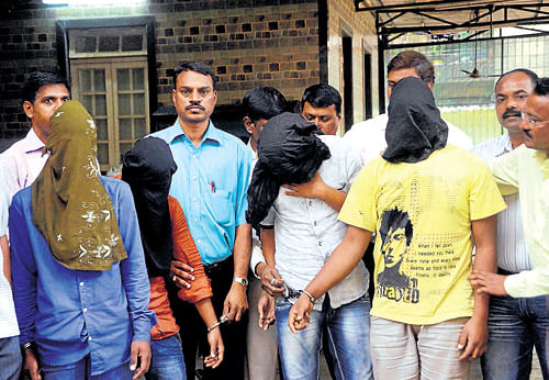 dark faces of mumbai: Police produce four of the five accused in the gang-rape case to the media in Mumbai  on Monday. pti