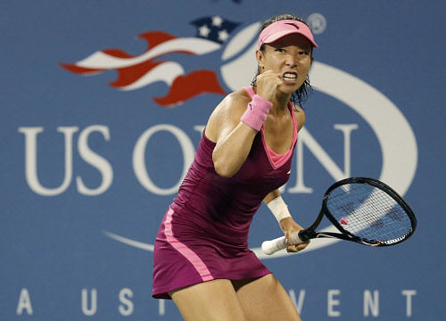 Zheng Jie of China celebrates winning a point against Venus Williams of the U.S. at the U.S. Open tennis championships in New York August 28, 2013. REUTERS
