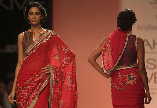 Models display creations by Krishna Mehta at the Lakme Fashion Week in Mumbai, India, Monday, Aug. 26, 2013. AP File Image