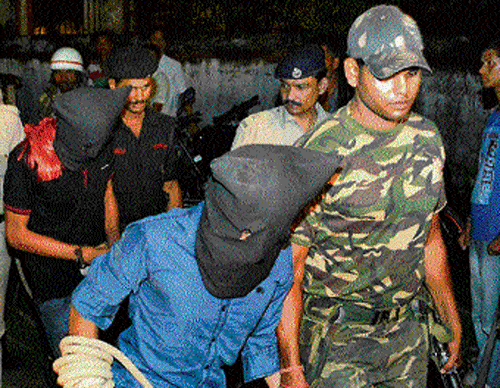 Yasin Bhatkal, along with an aide, is produced in a court in Motihari on Thursday.   PTI