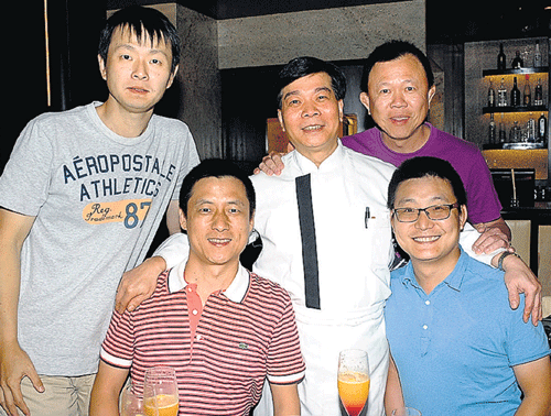 impressed: Lai Hin Tong William (centre, in white) with his friends.
