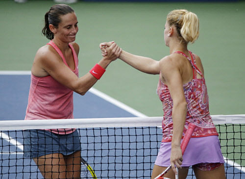 Roberta Vinci, of Italy, greets Camila Giorgi, of Italy, at the net after winning their fourth round match at the 2013 U.S. Open tennis tournament, Monday, Sept. 2, 2013, in New York. (AP Photo)AP photo.