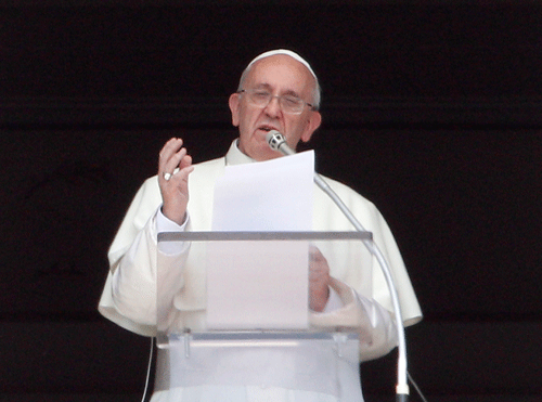 Pope Francis recites the Angelus prayer from his studio window overlooking St.Peter's Square at the Vatican, Sunday, Sept. 1, 2013. Francis is asking people to join him next weekend in a day of fasting for peace in Syria. The pontiff invited people of all faiths to join him Saturday evening in St. Peter's Square to invoke the 'gift' of peace for Syria, the rest of the Middle East and worldwide where there is conflict. (AP Photo)
