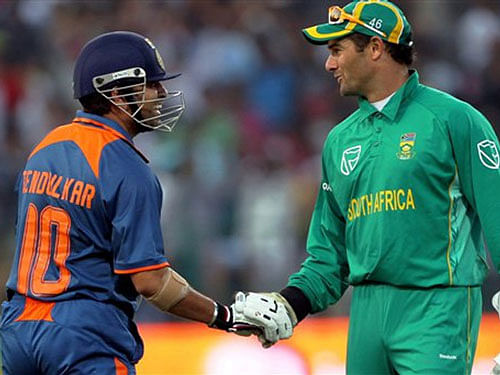 Sachin Tendulkar being congratulated by South Africa's Mark Boucher for his double century during the last South Africa Tour of India. PTI File photo