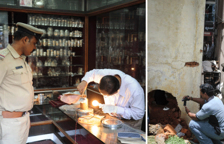 Forensic experts examining at Sampige Jewellery, where the burgalry took palce. DH photo