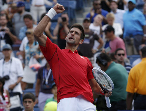 Novak Djokovic of Serbia celebrates after defeating Marcel Granollers of Spain at the U.S. Open tennis championships in New York September 3, 2013. REUTERS