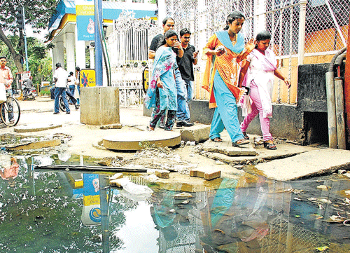 dirty: Sewage water overflowing from a manhole on MG Road.