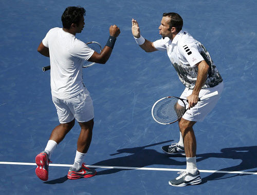 Paes of India and Stepanek of the Czech Republic celebrate point against Bob and Mike Bryan of the U.S. in their men's doubles match at the U.S. Open tennis championships in New York Reuters Image