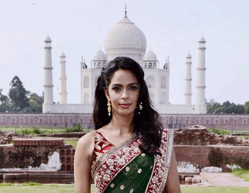 Actress Mallika Sherawat during a photo shoot for a private TV channel at the Taj Mahal in Agra on Thursday. PTI Photo