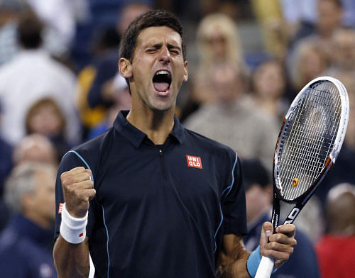 Novak Djokovic of Serbia celebrates defeating Mikhail Youzhny of Russia during their quarter-final match at the U.S. Open tennis championships in New York, September 5, 2013. REUTERS