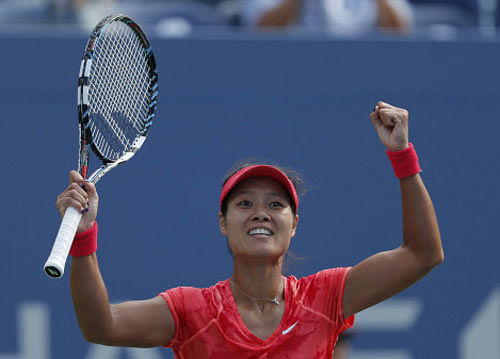 Li Na of China celebrates after defeating Ekaterina Makarova of Russia at the U.S. Open tennis championships in New York September 3, 2013. REUTERS