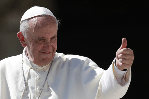 Pope Francis gives his thumb up as he leaves at the end of his weekly general audience in St. Peter's square at the Vatican, Wednesday, Sept. 4, 2013. AP photo