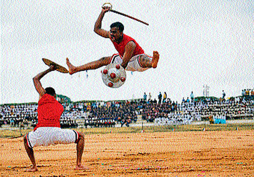 Army personnel perform Kalaripayattu at 'Know Your Army Mela,' in Mysore, on Saturday. dh photo