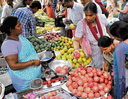 fruitful: Fruit vendors do brisk business ahead of  Gowri-Ganesha festival in the City on Saturday. Dh Photo