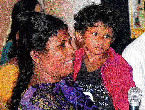 Sumitra, mother of Rashmi, studying in Lakshmi Ranganthan School, speaks at the public hearing on the implementation of the RTE Act, in Bangalore on Saturday. DH Photo