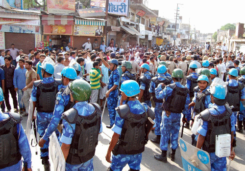 Heavy force at a crossing in Muzaffarnagar after fresh clashes between members of two communities. PTI Photo