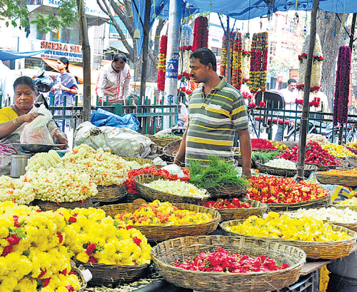 bustling The markets are filled with all kinds of flowers for Ganesha Habba.