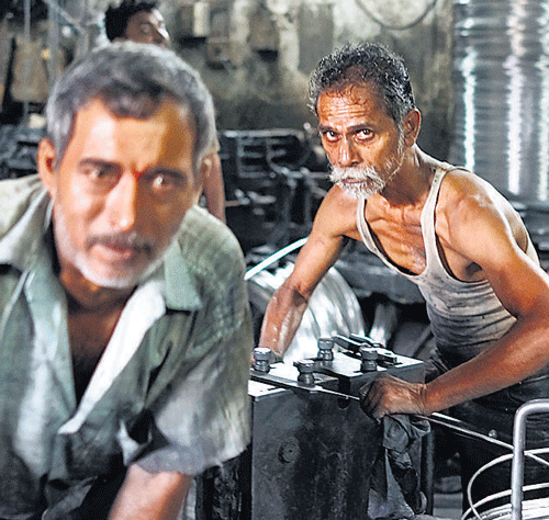 LOOM LOOMING&#8200;LARGE: (Left) Workers wind up wire at an aluminum workshop in India. India's antiquated infrastructure, a sclerotic job market, exorbitant real estate costs and bloated state-owned enterprises have kept  manufacturing, especially manufacturing for export, from growing strong enough to sustain the country during an economic decline. NYT