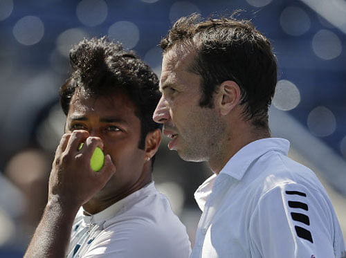 Leander Paes, of India, left, and Radek Stepanek of the Czech Republic plan the next point against Alexander Peya of Austria and Bruno Soares of Brazil during the men's doubles final of the 2013 U.S. Open tennis tournament, Sunday, Sept. 8, 2013, in New York. AP Photo