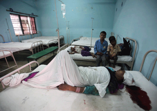Injureds at the district hospital in Muzaffarnagar on Sunday. Army was deployed in the curfew clamped areas of Muzaffarnagar after communal clashes on Saturday. PTI Photo