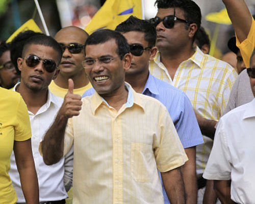 Former Maldivian President Mohamed Nasheed gestures to supporters during a final campaign rally. AP Photo
