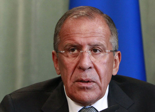 Russia's Foreign Minister Sergei Lavrov attends a news conference after a meeting with his Syrian counterpart Walid al-Moualem in Moscow, September 9, 2013. Russia and Syria urged the United States on Monday to focus on efforts to convene a peace conference and not on military action, Lavrov said on Monday after talks with Syria's foreign minister. REUTERS