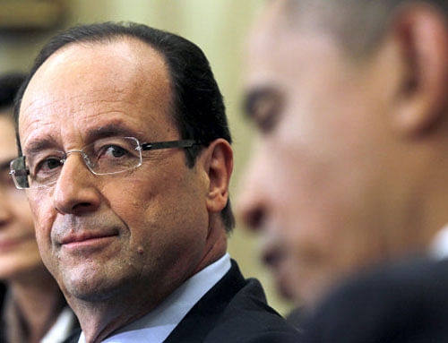 Barack Obama with his French counterpart Francois Hollande. File Photo
