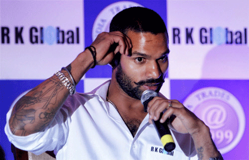 Cricketer Shikhar Dhawan talks to the media at an event in New Delhi on Tuesday. PTI Photo