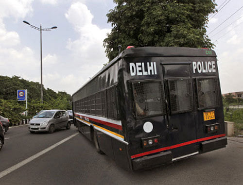 A police van leaves a court complex carrying four men convicted in the fatal gang rape of a young woman on a moving New Delhi bus last year,  AP