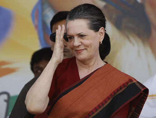 FILE- In this May 2, 2013 file photo, India's ruling Congress Party President Sonia Gandhi gestures to supporters during a campaign rally in Bangalore, India. India's most powerful politician and the leader of the ruling Congress party alliance Gandhi has left for the United States for a health check, party officials said Tuesday, Sept. 3. (AP Photo