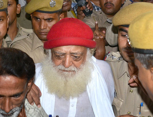 Asaram Bapu, a controversial spiritual guru who was arrested on Sept.1 on a rape charge filed by a teenage girl is brought to a hospital for a medical check up in Jodhpur. Ap File Photo