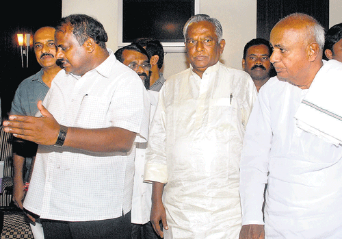 change of guard: JD(S) chief H D Deve Gowda with the party's new State president A Krishnappa and former president H D Kumaraswamy, at the core-committee meeting in Bangalore on Wednesday. dh photo