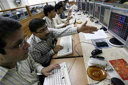 Stock brokers engage in trading at a brokerage firm in Mumbai February 14, 2008.  Credit: Reuters