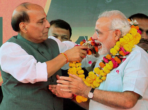 Gujarat Chief Minister Narendra Modi being greeted by the BJP President Rajnath Singh PTI File photo