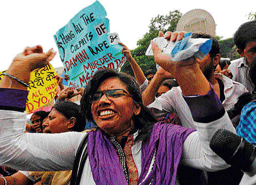 A demonstrator shouts slogans outside the Saket court in New Delhi on Friday. Reuters