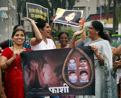 Women celebrate after the Delhi gang rape case convicts were awarded death sentence, in Mumbai on Friday. PTI Photo