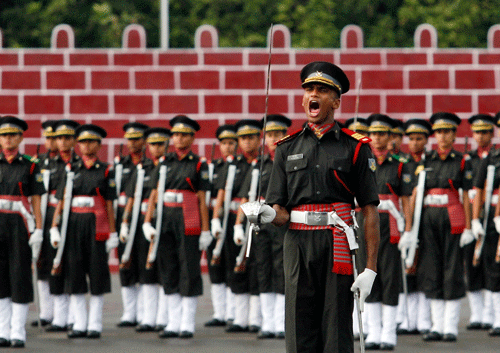 A cadet gives a command during a graduation ceremony at Officers Training Academy in Chennai, India, Saturday, Sept. 14, 2013. A total of 350 cadets graduated and will be posted as lieutenants in the Indian Army. AP Photo.