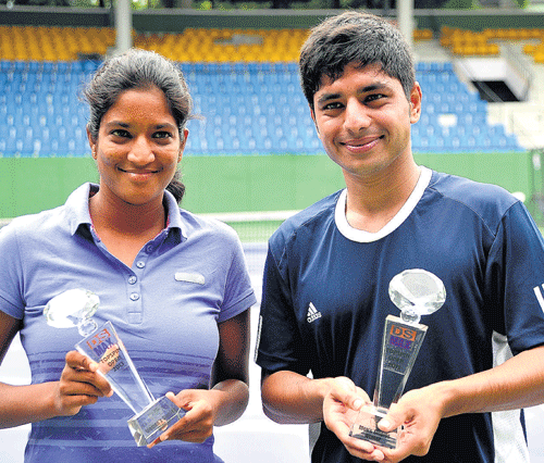 ALL SMILES: Tamil  Nadu's Sai Samhitha (left) and Chandril Sood of UP, winners of the women's and men's singles titles at the KSLTA Stadium on Saturday. DH PHOTO.