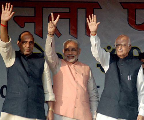 **FILE** Gujarat Chief Minister Narendra Modi with senior BJP leaders LK Advani and Rajnath Singh. File PTI photo
