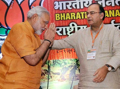 Gujarat Chief Minister, Narendra Modi being greeted by Arun Jaitley after anointed as Chairman of BJP Election Campaign Committee for 2014 polls at the party's National Executive meeting in Panaji, Goa. FILE PTI IMAGE
