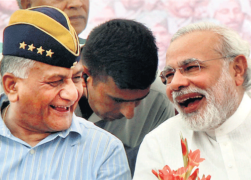 Gujarat Chief Minister Narendra Modi with retired Army chief V K Singh at a rally in Rewari, Haryana, on Sunday. PTI