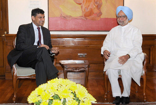 Prime Minister Manmohan Singh with RBI Governor Raghuram Rajan at a meeting in New Delhi on Tuesday. PTI Photo